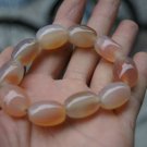 Natural light red (agate).Bracelet.9 drum-shaped beads. The rubber band strung together. Natural light red (agate).Bracelet.9 drum-shaped beads. The rubber band strung together.