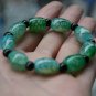 Green Dragon (agate), drum-shaped beads (bracelets). Rubber band strung