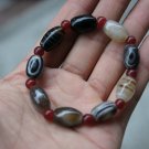 Nature black wrapping (agate) hand-carved, drum-shaped beads (bracelets).