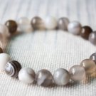 Dream agate, white agate fashion bracelet, beads around; 9 mm, 22 rubber band strung together. Dream agate, white agate fashion bracelet, beads around; 9 mm, 22 rubber band strung together.