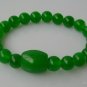 Green jade bracelet, carved, 8 mm beads + Passepartout, rubber bands strung together.