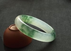Fine emerald floating flower bracelet, hand carved bracelet.
