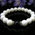 The natural white clams and black onyx bracelet, 10 mm beads, rubber band strung
