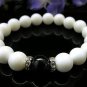 The natural white clams and black onyx bracelet, 10 mm beads, rubber band strung