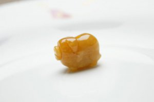 Hand-carved natural topaz, three-dimensional fortune pigs. Pendant necklace.