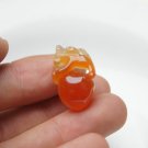 Hand-carved, natural orange agate brave play ball. Pendant necklace. Hand-carved, natural orange agate brave play ball. Pendant necklace.