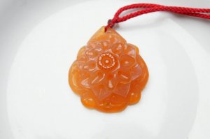 Hand-carved natural orange red agate peony. Pendant necklace.