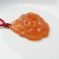 Hand-carved natural orange red agate peony. Pendant necklace.