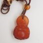 Natural (carnelian) pendants, amulets.Hand-carved laughing Buddha. Necklace pendant.