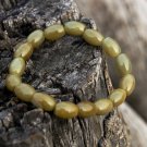 Natural khaki emerald, handmade, 8x11 mm, 16 drum bead bracelet, rubber bands strung Natural khaki emerald, handmade, 8x11 mm, 16 drum bead bracelet, rubber bands strung