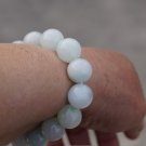 Hand-carved Yuanzhu. Natural white jade bracelet. 13 mm, 14 beads, rubber bands strung. Hand-carved Yuanzhu. Natural white jade bracelet. 13 mm, 14 beads, rubber bands strung.