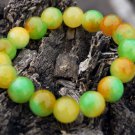 Yellow red green jade bracelet.13 mm, 17 beads. The tension of the rubber band. Yellow red green jade bracelet.13 mm, 17 beads. The tension of the rubber band.