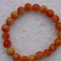 Red and yellow jade bracelet.10 mm, 21 beads. The tension of the rubber band.