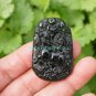 A hand-carved oval pendant. Natural dark green jade. Unicorn unicorn,