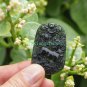 A hand-carved oval pendant. Natural dark green jade. Unicorn unicorn,