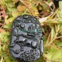 A hand-carved oval pendant. Natural dark green jade. Unicorn unicorn,