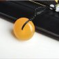 Handmade carving of natural yellow emerald peace button, talismanic necklace pendant