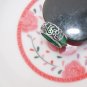 The alloy (fu) is inlaid with green jade rings. The vintage ring is about 17x8x3 mm