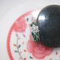 Alloy (plum blossom) green jade inlaid ring. The antique charm ring is about 17 x 7x3 mm.