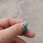 Alloy (plum blossom) green jade inlaid ring. The antique charm ring is about 17 x 7x3 mm.