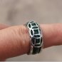 The alloy (currency) is studded with green jade rings. The ring is about 18 x7x3 mm.
