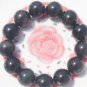 Natural obsidian bracelet. 16 mm 13 yuan beads. Rubber band strung.