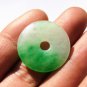 Floating emerald green peace buckle. Pendant. Good luck pendant.