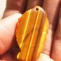 Natural tigereye amulet the mythical wild animal. Auspicious necklace pendant