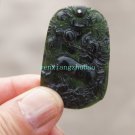 A hand-carved oval pendant. Natural dark green jade. Unicorn unicorn, A hand-carved oval pendant. Natural dark green jade. Unicorn unicorn,