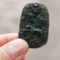 A hand-carved oval pendant. Natural dark green jade. Unicorn unicorn,