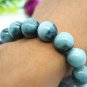 Handmade pure blue and white jade bracelet. 14 beads. A rubber band.