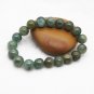 Handmade natural dark green agate beads, 10 mm 18. The rubber bands form a charm bracelet.