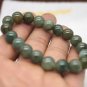 Handmade natural dark green agate beads, 10 mm 18. The rubber bands form a charm bracelet.