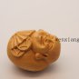 .Handmade, finely carved yellow poplar hanging - laughing Buddha. Talisman necklace pendant.