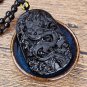 .Natural obsidian. Hand-carved oval flying dragon in sky - amulet - necklace pendant.