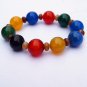 .Handmade natural red blue black agate beads 16 mm 10 rubber bands form an attractive bracelet.
