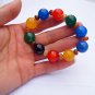 .Handmade natural red blue black agate beads 16 mm 10 rubber bands form an attractive bracelet.