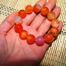 Natural red agate beads. The single bead is about 16 mm in diameter and forms a bracelet. Natural red agate beads. The single bead is about 16 mm in diameter and forms a bracelet.