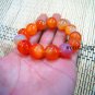 Natural red agate beads. The single bead is about 16 mm in diameter and forms a bracelet.