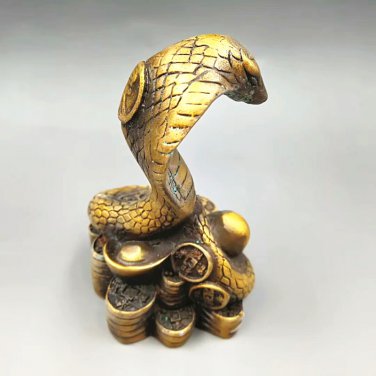 Copper and gold. Ancient money snake (court system). To ward off bad luck. The treasure of the city.