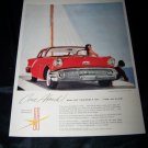 Vintage 1957 Oldsmobile Golden Rocket Holiday Print Ad