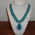 Neck lace crocheted blue glass pendant Neck lace crocheted blue glass pendant