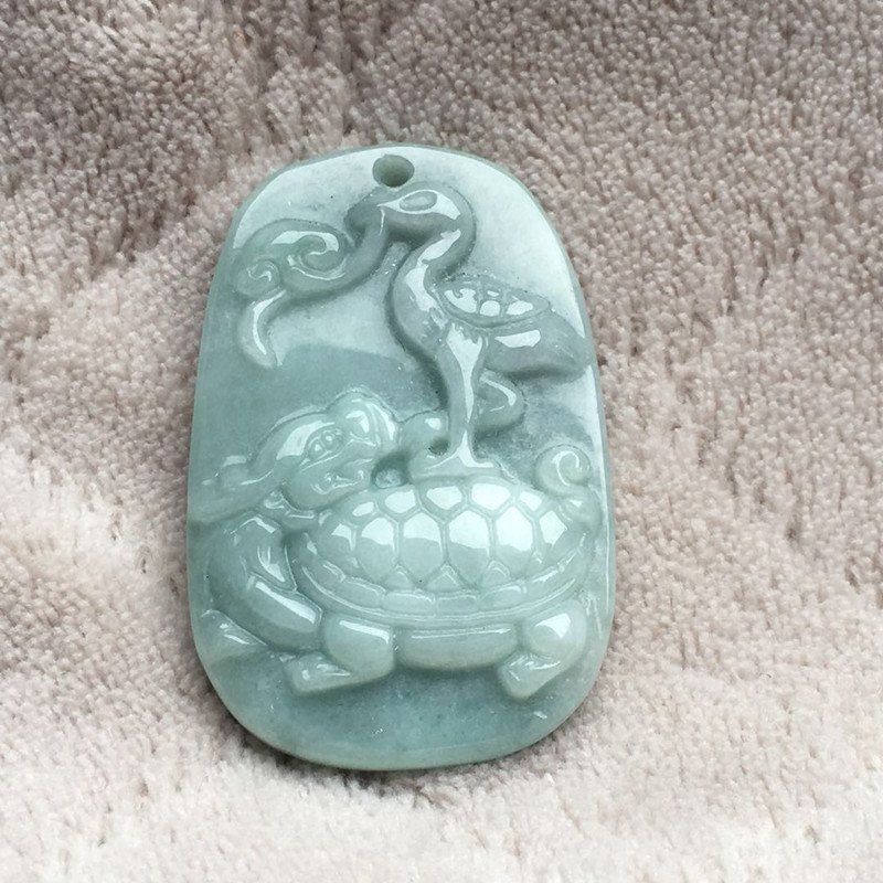 Hand-carved exquisite jadeite dominates the talisman jade pendant