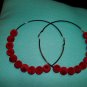 Large black and red hoop ear rings
