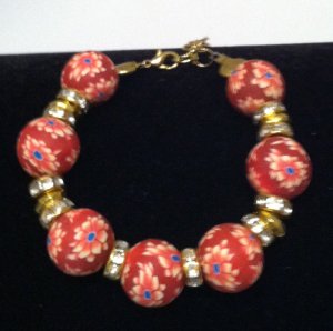 Red Clay surrounds beautiful floral designs bracelet