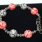 2 cane style polymer clay beads are used in this bracelet