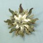 *Sunburst-shaped Soft Goldtone Brooch Sparked with Pretty Purple Rhinestones