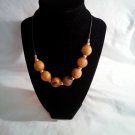 Black Cord with Large Wood Beads and Gold Tone Beads Between