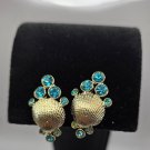 Silver Tone Shell Shape with Aqua Marine Colored Stones Clip On Earrings (CO1) Silver Tone Shell Shape with Aqua Marine Colored Stones Clip On Earrings (CO1)
