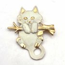 White Cat hanging on a Gold Tone Tree Limb Brooch Pin (J1) White Cat hanging on a Gold Tone Tree Limb Brooch Pin (J1)